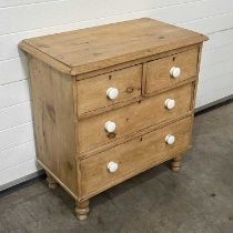 A chest of drawers, fitted four drawers: two short over two long, on turned feet W: 85 cm D: 48.5 cm