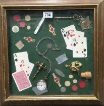 A shadow box collection, pocket watch, playing cards and gambling chips, framed