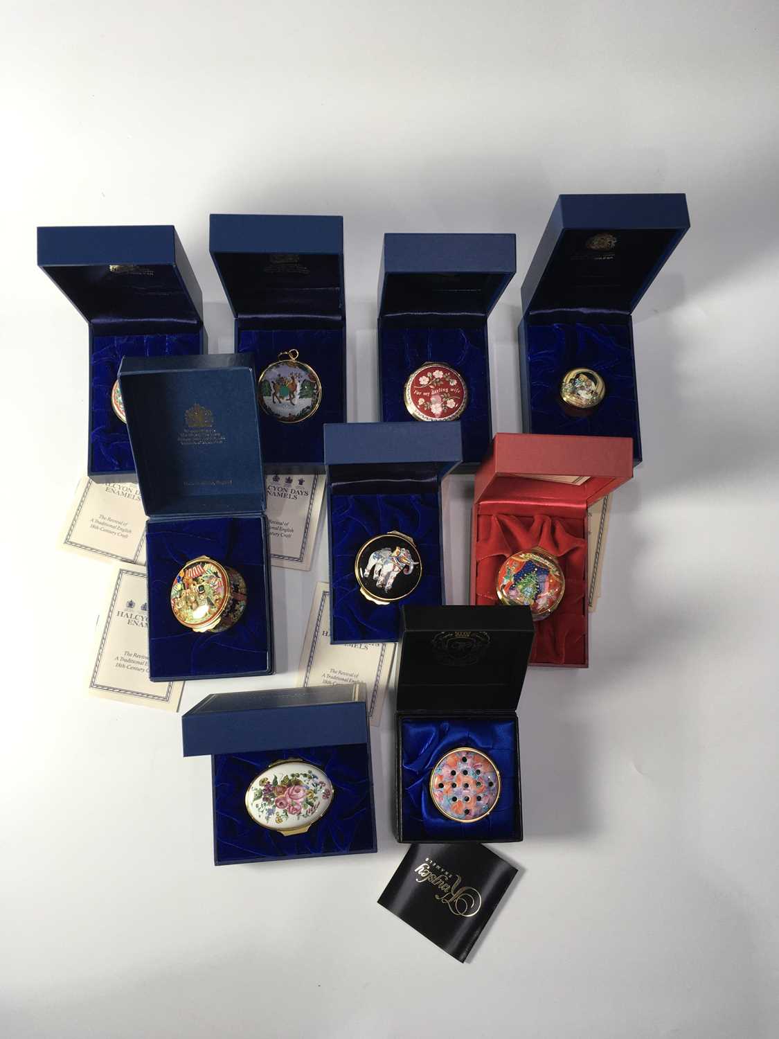 Nine Halcyon Days enamelled trinket/patch boxes, various forms and designs including commemorative