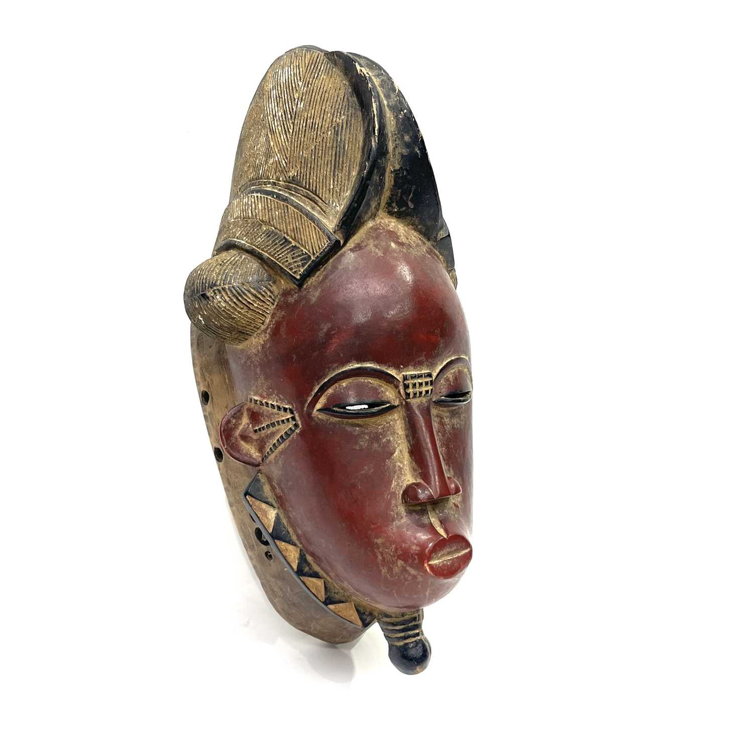 A Baule 'portrait mask', Ivory Coast 46.5 cm tall