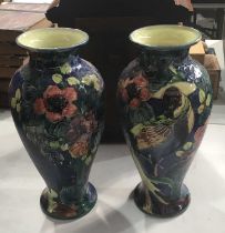 A pair of Thomas Forester & Sons Trogon ware vases, baluster form, circa 1900, relief decorated with