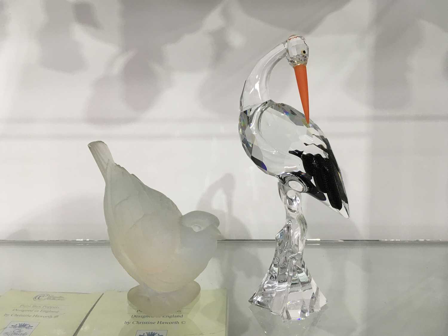 A Ferjac French opalescent glass model of a perched bird, moulded mark, 10cm high, together with a