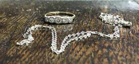 A 9ct gold five stone diamond ring, together with fine white metal chain