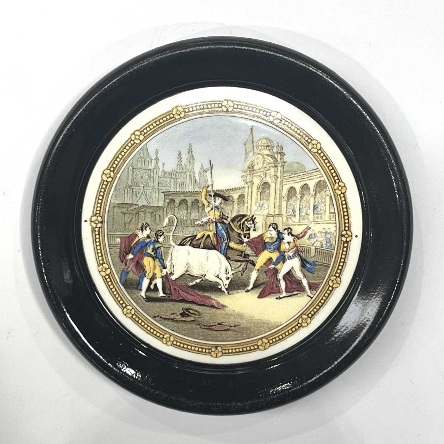 A Kirkhams pottery Prattware style plaque in the form of a pot lid, Bull Fight, 1947, 18.5cm