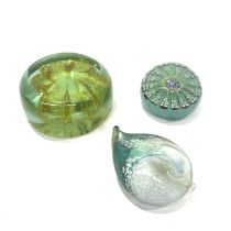 A Mdina jellyfish glass paperweight, flat-topped, a glass millefiori paperweight, and a Selkirk