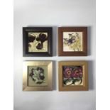 Four Moorcroft Tubelined plaques, including Grizzled Butterly, Chocolate Cosmos and Berkshire Rose