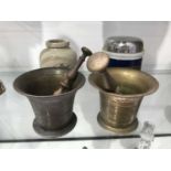 Two 19th century brass pestles and mortars, an Ung Sedative pottery drug jar, and associated metal