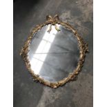 Oval metal framed gold mirror