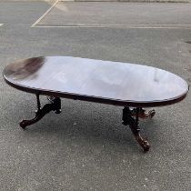 An oval extending table, fitted too leaves W: 240 cm D: 121 cm H: 74 cm, with lever