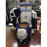 A large Chinese Pottery jardiniere stand in the form of an elephant, 43cm high, together with an