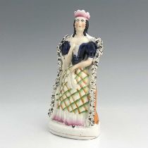A Staffordshire figure of Sarah Siddons as Lady Macbeth, circa 1850, modelled as a Queen in textured