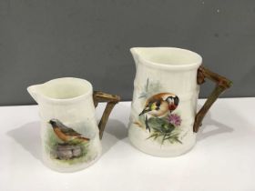 Edward Townsend and George Cole for Royal Worcester, circa 1940, two bird painted barrel jugs,