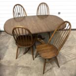 An Ercol Golden Dawn Chester extending dining table, extending top with hidden leaf, on pedestal