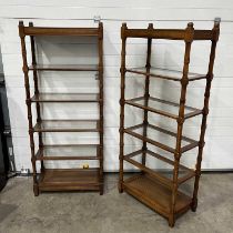 Two glass-shelved bookcases/display stands W: 76.5 cm D: 41 cm H: 183.5 cm