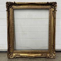 A gilt picture frame with glass (Total frame: 82 x 94 cm, glass panel 59.5 x 71 cm