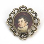 A 19th Century oval portrait brooch, bust of a gentleman wearing a ruff, on ivory, in a yellow metal