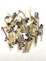 Seventy-two antique bone lace bobbins, decorated, some with pewter spots and wire, others with brass