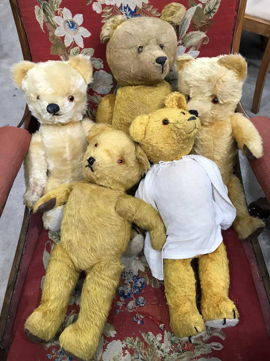 A collection of teddy bears, one with hunched back (5)