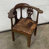 A corner chair, with double pierced splat, drop in leather seat with Celtic knot design, on