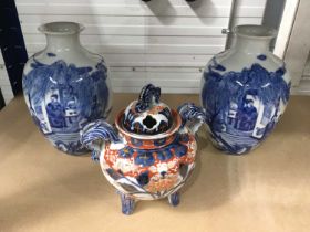 A pair of Chinese blue and white baluster vases, Qianlong seal marks to bases, 21cm high, and an