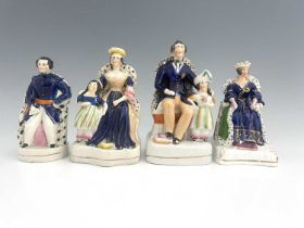 Four Staffordshire royal figure groups, circa 1840, including Queen Victoria, possibly at her