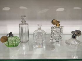 A collection of French glass perfume bottles including Marcel Franck atomiser, lozenge black moulded