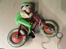 A Tri-ang Cord Gyro cyclist, tinplate and celluloid, 20cm wide