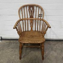 A traditional fruitwood Windsor armchair