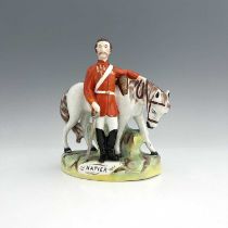 A Staffordshire figure of Sir Charles Napier, by Thomas Parr, circa 1870, modelled standing beside