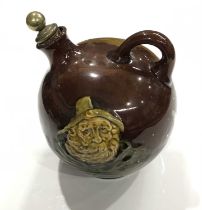 Noke for Royal Doulton, a Kingsware Fisherman flask, globe form with loop handle, brown glazed