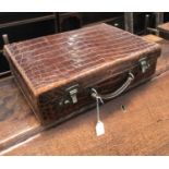 λ A vintage alligator briefcase, single handle, fitted interior, and notepad case, 41cm long, 29cm