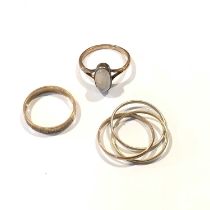 Two gold band rings and a moonstone ring