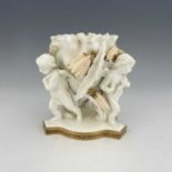 Moore and Co., a blanc de Chine figural bowl, circa 1860, modelled as three winged putti