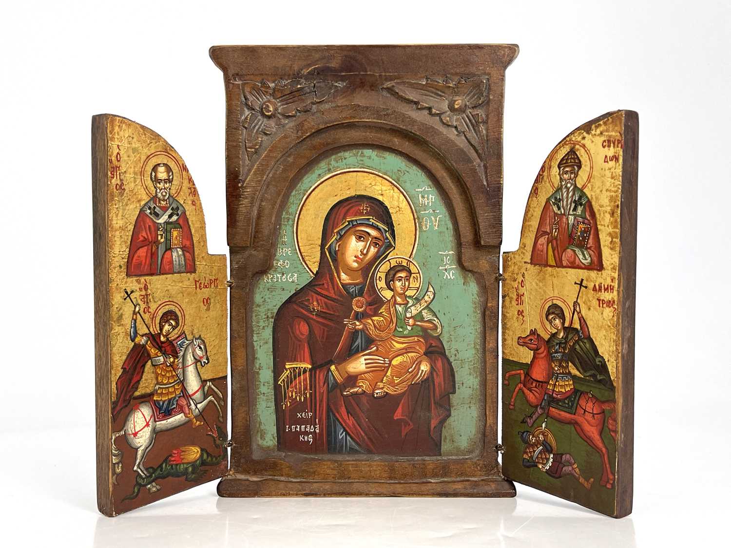 A Greek Orthodox triptych ikon, wooden frame with leaf-carved spandrels to the pediment, hinged - Image 2 of 6