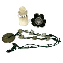 A silver mounted onyx type scent bottle and stopper, a jadeite necklace of carved beads and a