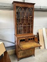 A George III walnut bureau bookcase, astragal glazed doors above fall front and fitted interior,