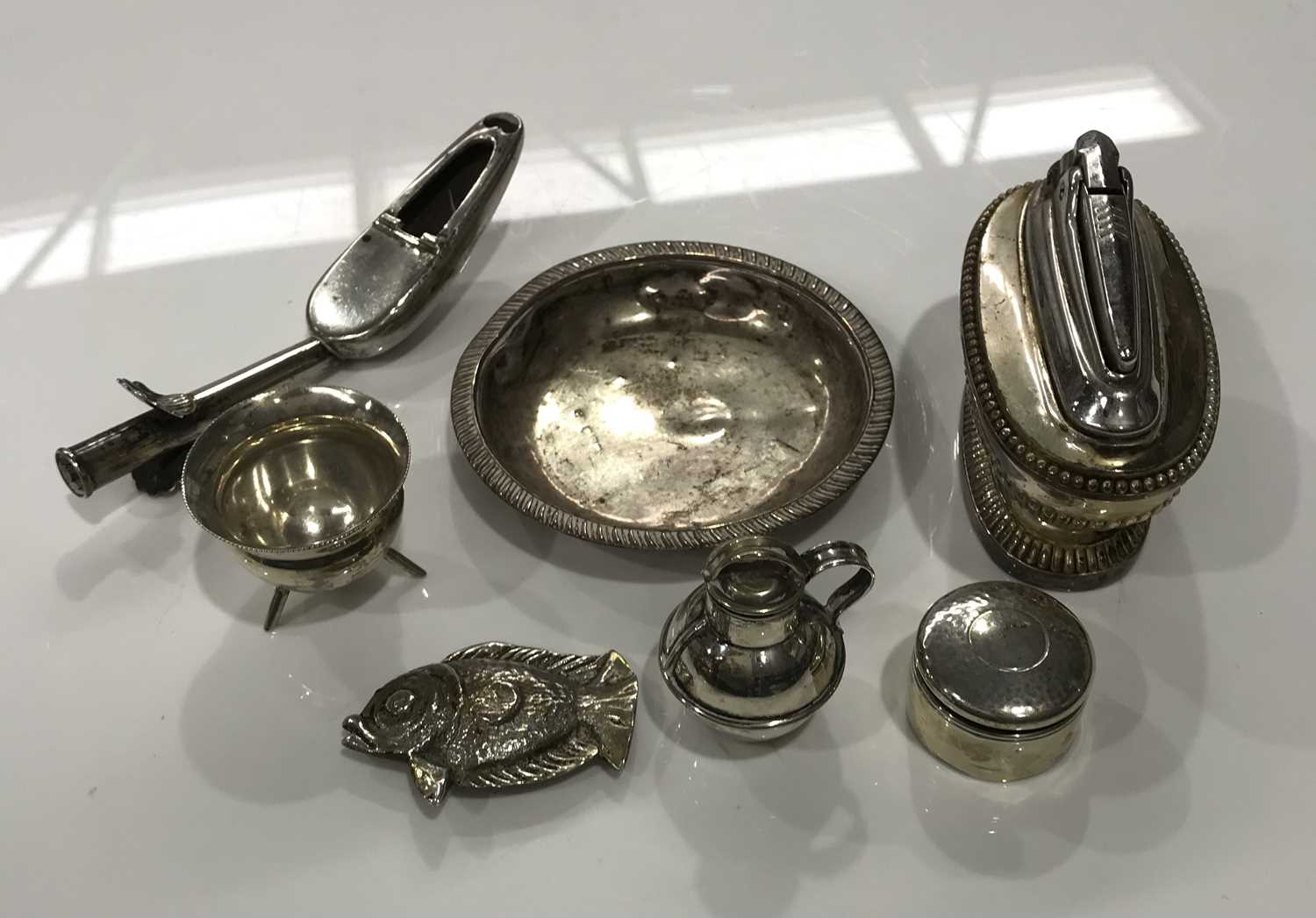 A hallmarked silver pin or trinket dish, silver tripod base salt, rouge pot, plated medicine