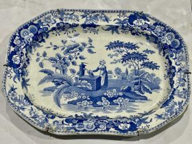An early 19th century blue and white meat plate, The Font, octagonal form, decorated with a lady