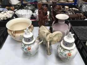 A collection of ceramics including a Capodimonte elephants, a Wedgwood jasperware Grecian vase,
