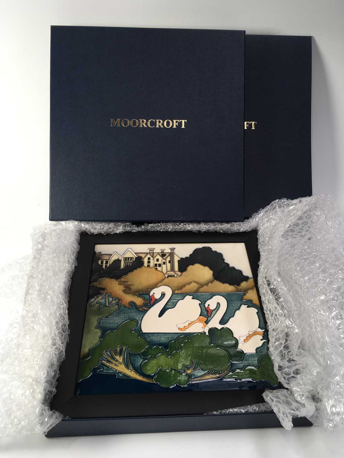 Kerry Goodwin for Moorcroft, a framed plaque, circa 2015, square form decorated with swans with