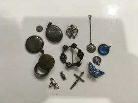 Silver and costume jewellery including locket, Scottish brooch, crucifix pendant etc.