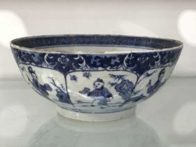 A Chinese blue and white bowl, footed form, painted with panels of boys within foliate border,