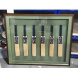 A set of six miniature cricket bats, signed by County Teams, Derby, Sussex, Worcestershire,