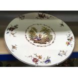 A large decorative ironstone china plate