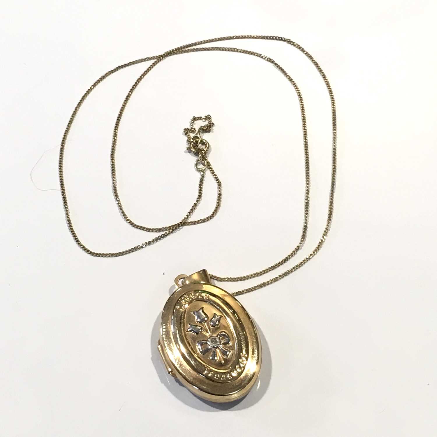 A 9ct gold locket pendant, with chain
