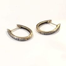 A pair of 9ct gold diamond half hoop earrings