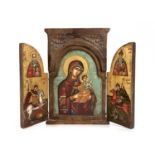 A Greek Orthodox triptych ikon, wooden frame with leaf-carved spandrels to the pediment, hinged