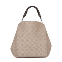 Louis Vuitton, a Mahina Babylon handbag, featuring a perforated monogram beige leather exterior,