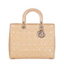 Christian Dior, a Lady Dior GM handbag, designed with the maker's signature cannage quilted cream