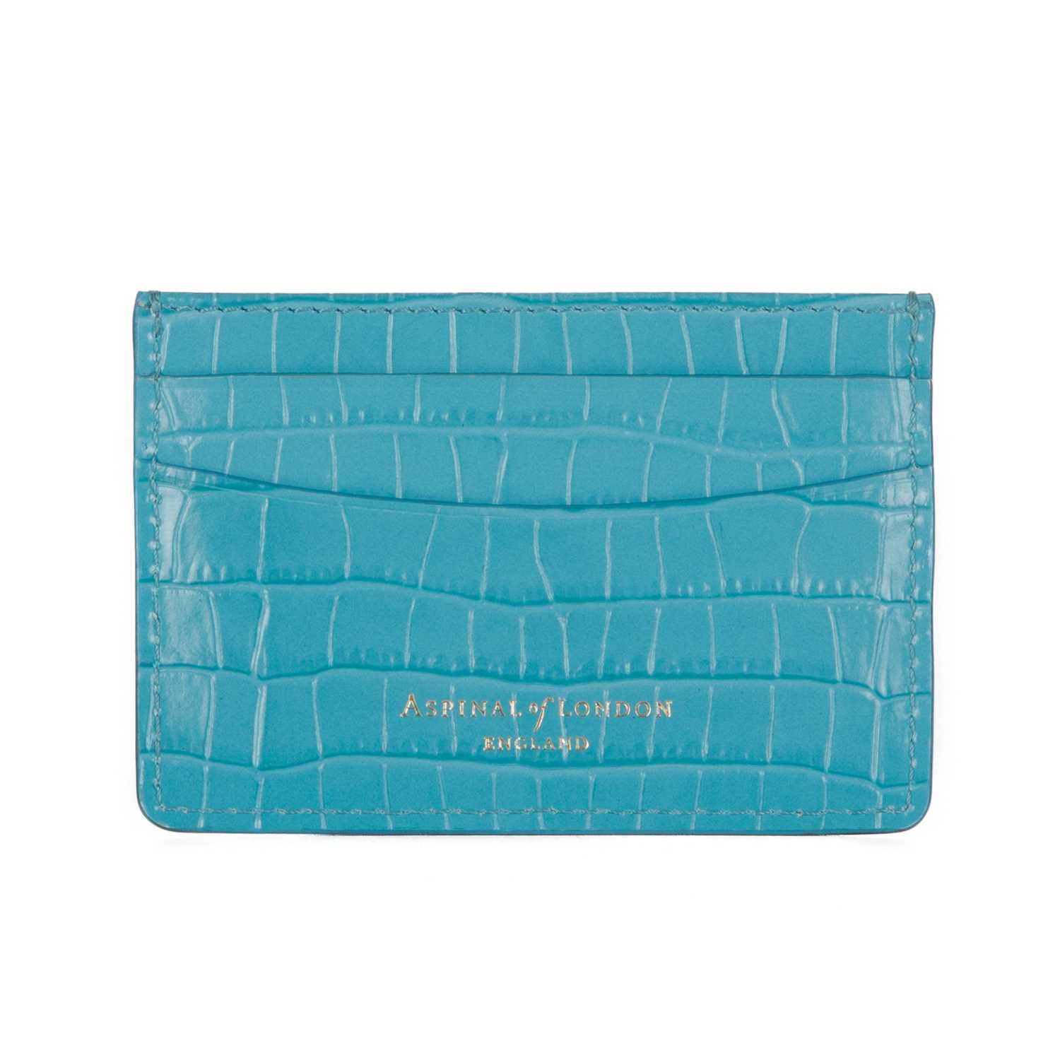 Aspinal of London, a croc-embossed leather card holder, crafted from turquoise blue crocodile